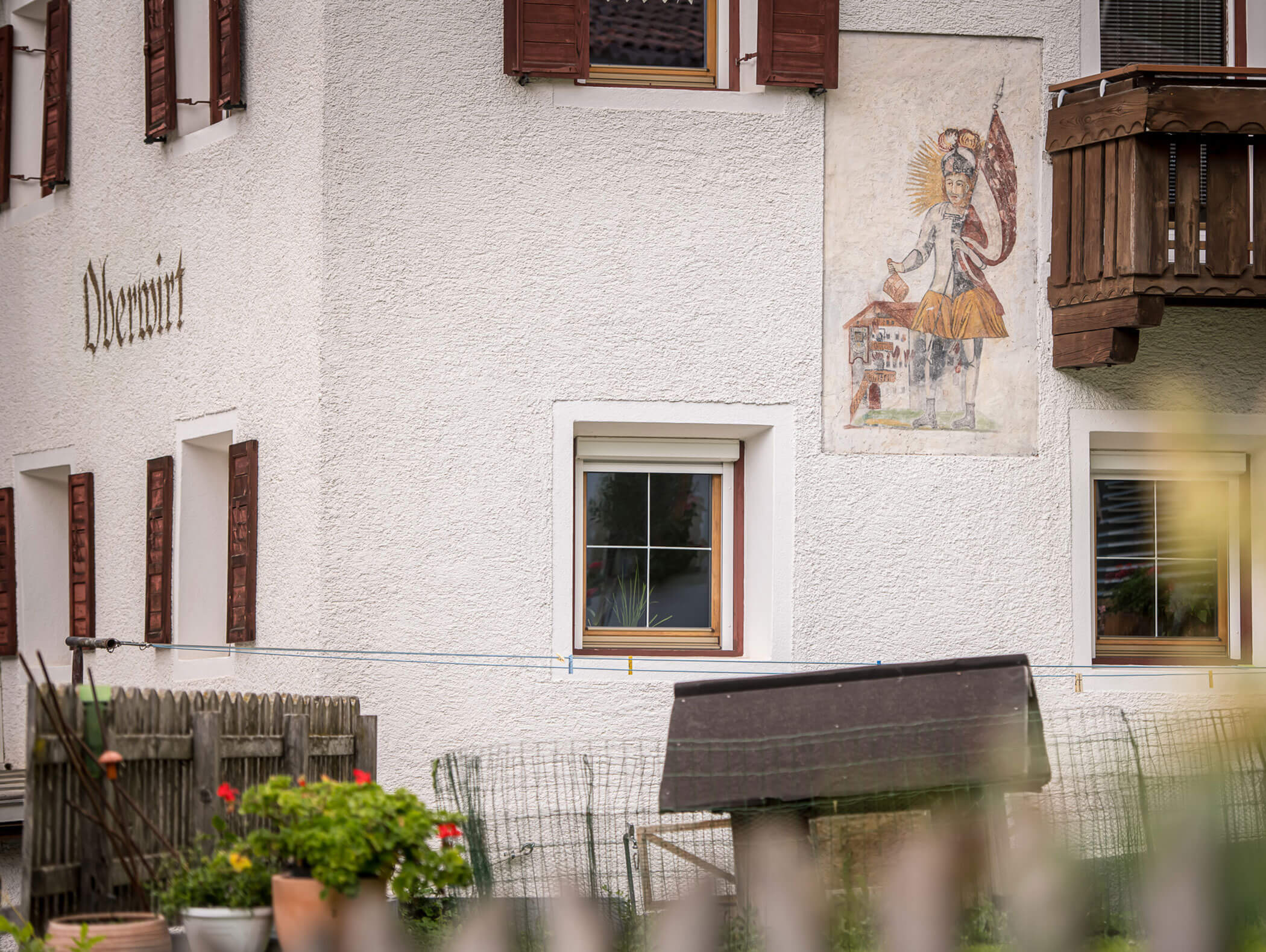 Pension Oberwirt from outside with rabbit hutch in front - Pension Oberwirt